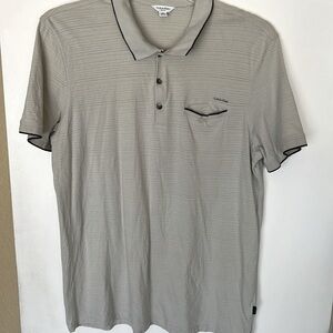 Perfect for summer! Calvin Kline Polo in tan with black piping details